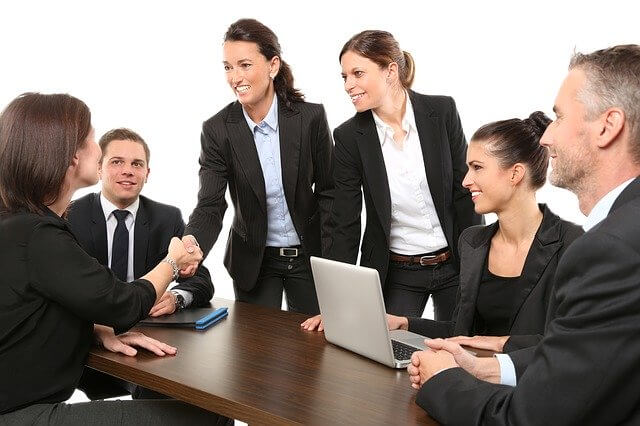 Employees discuss together in editorial meeting